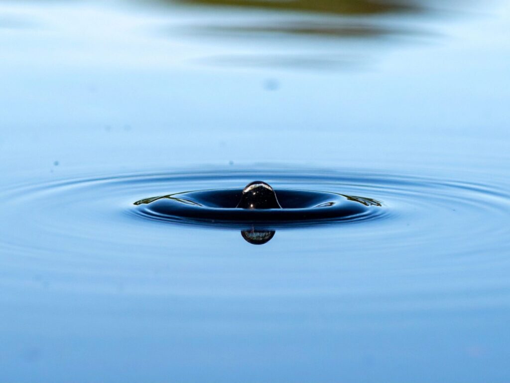 Ripple on still water symbolizing influence and leadership by example